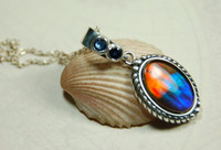 Ammolite pendant with sapphires.Canadian Ammolite Jewelry.