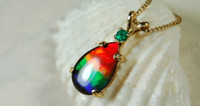 Ammolite Pendant in Gold with Emerald Accent.