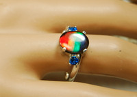 Ammolite ring.Four color rainbow.Blue Spinel side stones.