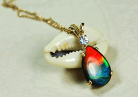 Ammolite pendant in gold.Ammolite Jewelry Rainbow.