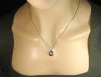 Ammolite pendant.Rich rainbow colors.Sapphire companion.