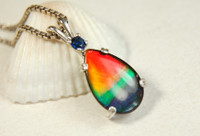 Ammolite Jewelry Pendant.Rainbow gem with Sapphire.