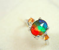 Ammolite ring.Faceted rainbow gem. Padparadscha sapphires.Size 7