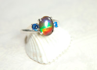 Ammolite ring with blue Spinel side stones.Size 7.The perfect gift for her.
