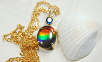 Petite Ammolite pendant in gold with Sapphire.The perfect gift for her.