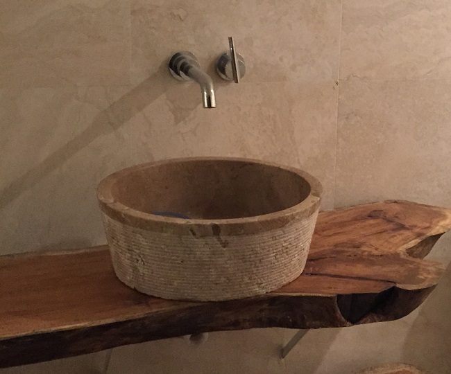 tashmart-brushed-natural-stone-sink-in-noce-travertine-installed.jpg