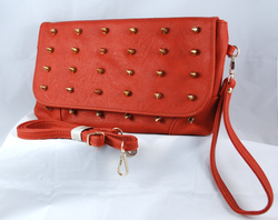 Front view of spike suede purse showing strap & wristlet