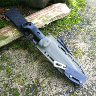 Piggyback Grizzly Elite Custom KYDEX sheath for Becker BK7 and BK13 angled in Olive Drab and Black with milled slots, firesteel and D-ring swivel belt loop.  Suitable for Becker, Esee, Cold Steel, Ka-Bar, Mora, Ontario, Schrade, and SOG knives.
