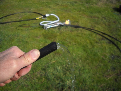 A successful installation of the No Power Water Pump water-flowing-out-of-pipe-pump-is-working.jpg