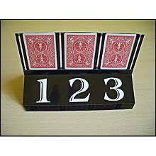 Trio - Astor 
The 3 predictions written by the Magician are exactly matches with the cards selected by the spectator. The Magician uses a deck of cards and a transparent plexi card stand for the trick. The deck used is normal pack of cards not gimmicked, so the audience can examine it. Before the trick the spectator can shuffle the deck. 
No sleight of hand is involved