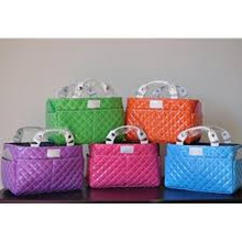 Specifically designed for figure skaters, who step on the ice with a handful of gears every day, this Rink Tote makes "in and out of the rink" so much easier. With various open pockets of different sizes and purposes, not only does it make easily accessible to what you need during the practice, but also it keeps everything well-organized all in one place. 
•Short handles that stay out of the way once it's down, yet just long enough so you can simply grab and go 
•Side pockets that are perfectly sized for CD cases
 Multi-purpose front pockets for pens, cell phone, iPod, etc. 
•Back strap to secure it on top of your ZUCA bag or suitcase handle •Main compartment with a detachable center divider 
•Perfect size to house a small tissue box in one side and a water bottle, a practice note, blade guards, etc. in the other 
•With the divider taken out, it can house the standard size tissue box Approx. Dimensions: 9.5 x 6 x 5.5 in. (Varies slightly between styles, depending on the materials used)