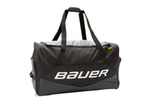 The Bauer® Premium Carry Hockey Bag features an easy access main compartment and separate organization pockets to help keep your gear in order. This premium carry bag features weather proof, heavy duty material to withstand the rigors of a long season. Great for indoor or outdoor games the Bauer® Premium Carry Hockey Bag is ideal for any player.

FEATURES
U-Shape opening offers easy access for main compartment
Dura Hex ripstop polyester fabric with heavy duty polyester accents for maximum durability
Weather proof material
Separate skate, helmet, and accessories pockets helps organize gear
Increased breathability with integrated mesh and dry flow grommets
37” x 20” x 17.5”