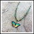#16. Island Green Butterfly Necklace: $75
 gold / dark rim/gold overlay chain
Niobium
• Swarovski crystal
• Bohemian glass
• Gold overlay chain
• Adjustable: 18-20" long
• Drop: 3/4" l. x 1" w.
