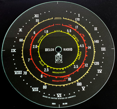 Dial image taken against a black background to illustrate white print. Dial glass is clear other than scale printing.