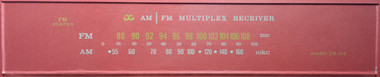 Photo of dial taken against a red background to illustrate white print. Glass is clear except for printing.