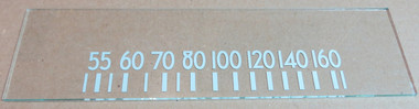 Dial image taken against tan/brown background to illustrate white scale print. Dial glass is clear other than scale print.