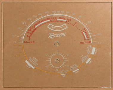 Dial image taken against a tan/brown background to better illustrate off-white portions of dial scale. Dial is clear other than dial scale print.