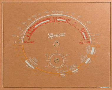 Dial image taken against a tan/brown background to better illustrate off-white portions of dial scale. Dial is clear other than dial scale print.