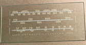 Dial image taken against tan/brown background to illustrate  light color dial print - dial is clear glass other than dial scale printing