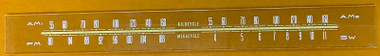 Dial image taken against a yellow-orange background to better illustrate the dial scale print. The dial glass is clear other than the scale print.