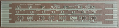 Dial image take against a tan background to illustrate dial print - dial is otherwise clear.