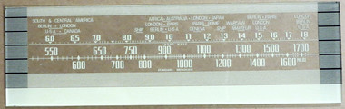 Dial image taken against a gray/tan background to better illustrate off-white portions of dial print. Dial glass is clear other than print.
