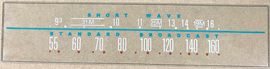 Dial image taken against a tan background to better illustrate the white portions of the dial scale. The dial glass is clear other than the scale printing.