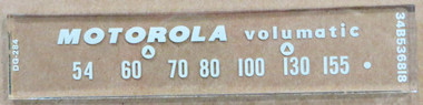 Dial image taken against a tan/brown background to illustrate white dial print. Dial glass is clear other than scale printing.