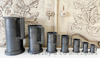 A Set of Seven Antique French Pewter Measuring Jugs Stamped - E358a