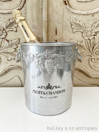 A vintage French Moet & Chandon champagne bucket with grapes design.