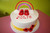 Buttercream covered. Gumpaste red slippers. fondant band and flowers. Gumpaste rainbow. "Wizard of Oz" theme 
Servings: 50