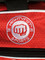 Red duffle, embroidered Mightyfist logo on top of pouch
