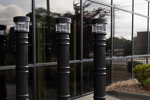 UV Lighted Bollard Covers lining an office front 