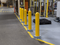 Row of Bounce Back Bollards lining a forklift lane 