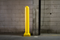 Yellow 6" x 48" Plated Bollard Cover protecting overhead door tracks