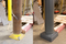 Comparison of Base Plate Bollard with exposed anchor bolts and a Gray Plated Bollard Cover 