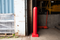 Red 6" x 48" Plated Bollard Cover protecting overhead door tracks