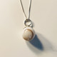 10mm solid pearl with lock of hair added