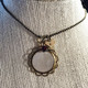 shown with a stamped butterfly charm