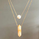 shown layered with the delicate crystal necklace