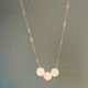 shown with one solid pearl in between two swirled pearls
