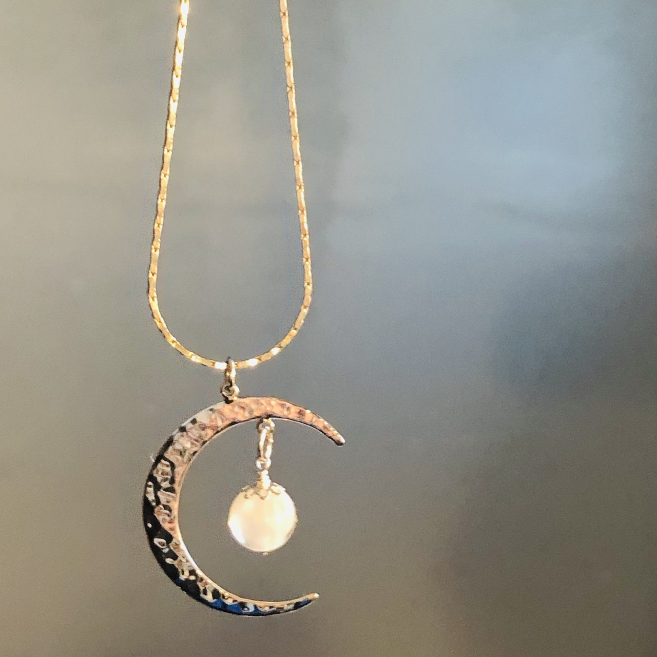 Moon and pearl necklace