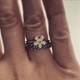shown paired with a daisy flower ring