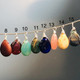 8 July-Ruby (transparent), 9 July-Ruby (opaque), 10 August-Peridot (opaque), 11 August-Peridot (transparent), 12 September-Sapphire, 13 October-Pink Tourmaline, 14 November-Topaz, 15 December-Turquoise