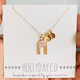 shown with gold tiny initial tags