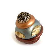 Round Tudor knob 2 in. diameter colored in agate, deep opal and amber with gold metal details.
