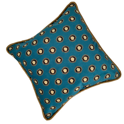 Printed velvet Soho pillow shows modern polka dot pattern with rich teal background. 
