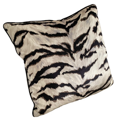 The Serengeti pillow has a modern zebra pattern  in printed velvet in shades of silver with black and white. 