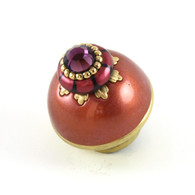Nu poppy coral 1.5 inches diameter has gold painted stem to complement the metal details