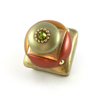 Duo Square Knob Copper 1.25 Inches with gold metal details and olivine crystal.